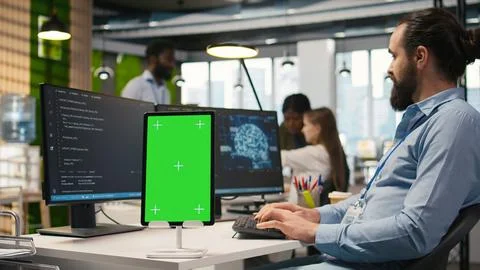 Startup technician using isolated screen tablet, developing AI models Stock Photos