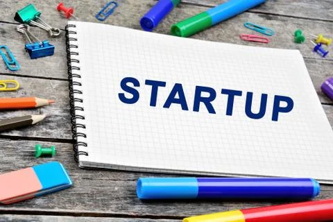 Startup word on notebook Stock Photos