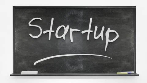 'Startup' written on blackboard Stock Photos