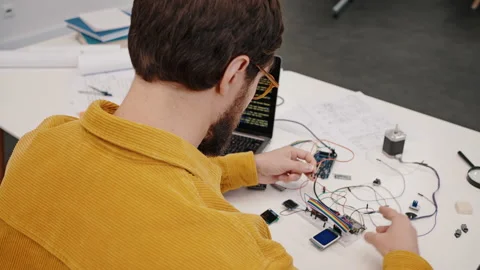 Startupper in glasses develops modern electronic device Stock Footage 219868863