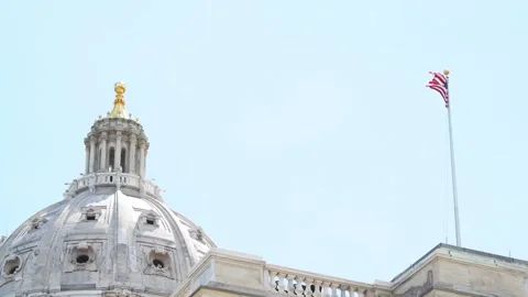 State capitol dome with American flag flying in the wind in Minnesota Video stock 327868110