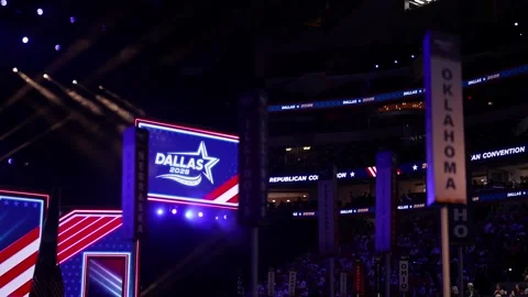 State delegation signs, including Oklahoma, and a 'Dallas 2026' sign on the Stock Footage 345274191