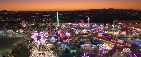 State Fair grounds sunset with Ferris Wheel Wide - 5.2k Stock-Footage 197526323