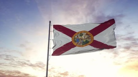 State flag of Florida waving in the wind. Dramatic sky background. 3d illustr Illustrazione stock