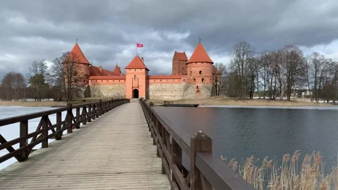 State flag of Lithuania is waiving on top of Trakai Island Castle. Lithuania Stock Footage 221611413