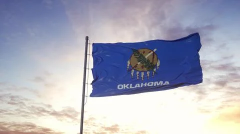 State flag of Oklahoma waving in the wind. Dramatic sky background. 3d illust Stock Illustration