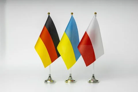 State flags of Germany, Poland and Ukraine on a light background. State flags Stock Photos