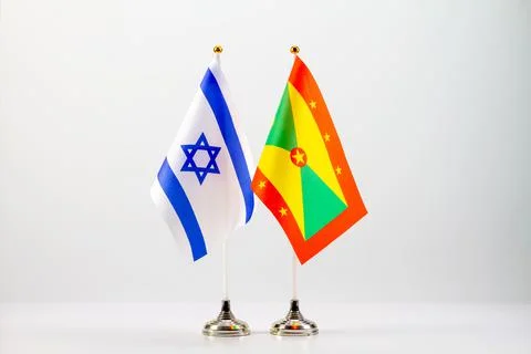 State flags of Israel and Grenada on a light background. Flags of states. Stock Photos