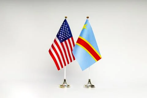 State flags of the USA and DR Congo on a light background. Stock Photos