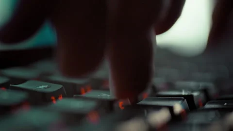 In a state of flow a programmers fingers rapidly dance across the keyboard t Stock-Footage 336570876