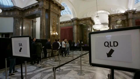 State signs and queue barriers inside the overseas polling place Video stock 345299006