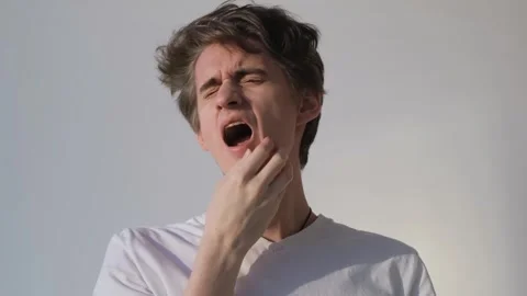 The state of weakness in a young guy after lack of sleep Stock-Footage 283401156