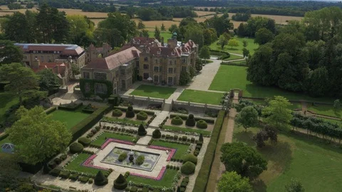 Stately home with multiple symmetrical and landscaped gardens, drone aerial 4K Stock Footage 101134547