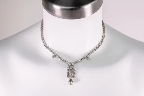 Statement necklace on a white mannequin, massive unusual handmade jewelry Stock Photos