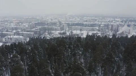 A statement shot of the winter city after the snowfall. Aerial view of the snow Stock Footage 194730728