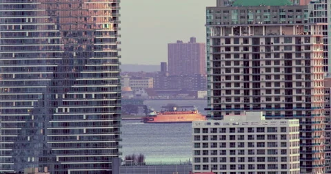 Staten Island ferry passing between buildings 4K Video stock 171288498