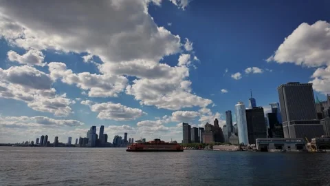 Staten Island Ferry Passing Lower Manhattan Skyline Under Dramatic Summer Clouds Stock Footage 340900364