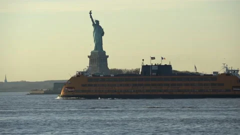 Staten Island Ferry passing Statue of Liberty in New York City. Famous Landmark Stock Footage 200344520