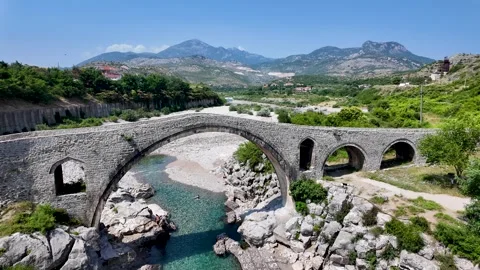 Static 4K Shot of Historic Mesi Bridge in Albania Stone Arch over River Video stock 313046228