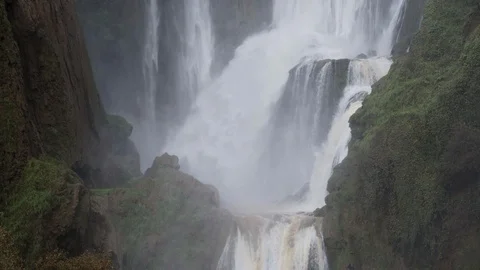 Static 4K tele shot of a waterfall crashing onto a rock formation Stock Footage 100271245
