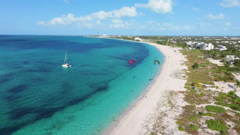Static aerial 4K footage of Grace Bay coastline featuring parasailing, a Stock-Footage 277872190
