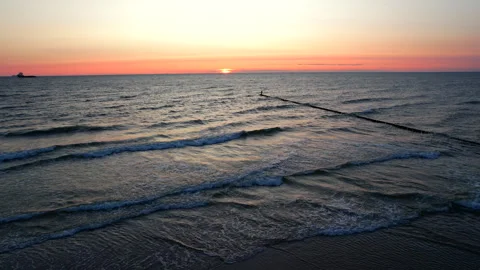 Static aerial background of sea waves at golden sunrise. Vídeos de archivo 338140050