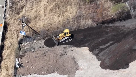 Static Aerial of Bulldozer Grading Dirt Lot Near Jersey City Highway Vídeo Stock 344596959
