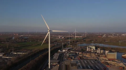 Static aerial close view of wind turbine in warm evening light Video stock 335651676