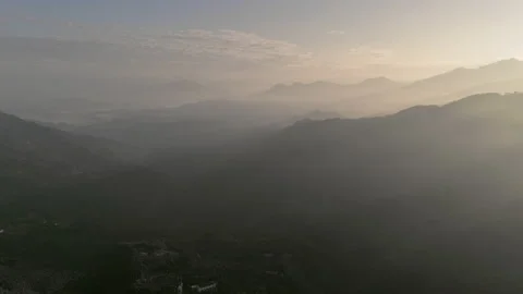 Static aerial drone shot of sun streaks over misty mountains in Taiwan. Stock Footage 185389610