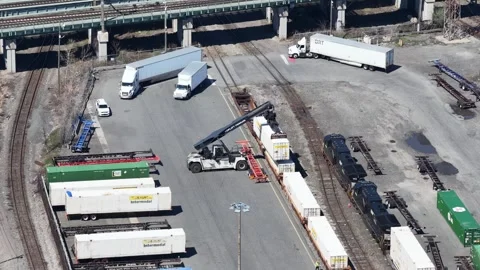 Static aerial of J.B. Hunt trailers under highway bridge, Jersey City Vídeo Stock 344597070