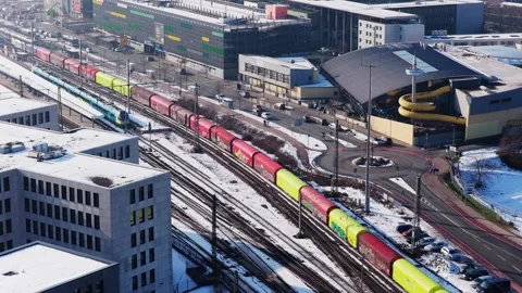 Static aerial perspective of freight train transporting cargo containers through Stock Footage 335307816
