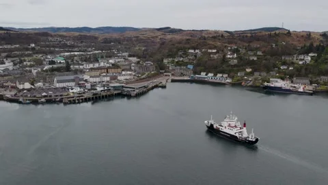 Static aerial shot of Calmac ferry MV Coruisk heading towards Oban pier Stock Footage 239449540