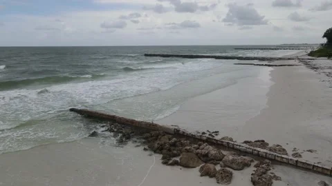 Static aerial shot of a cloudy blue sky over some tropical Florida beach wave Stock Footage 140136815