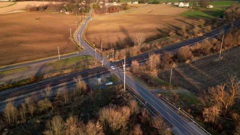 A static aerial shot hyper lapse of traffic crossing train tracks Stock-Footage 256524625