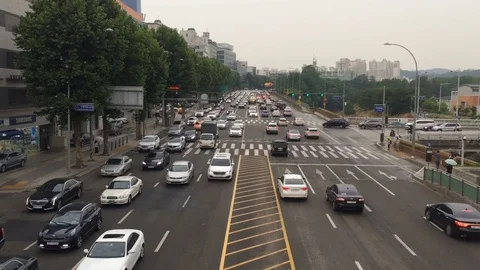 Static aerial shot typical big city in Asia. People walk on street in rainly Stock Footage 81274706