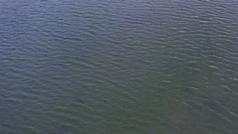 Static aerial shot of a waves on lake Stock Footage 121039916