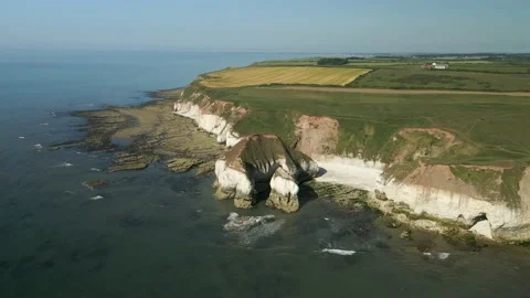 Static aerial shot of white cliffs at Flamborough head with blue ocean Stock Footage 200019220