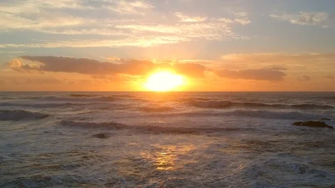 Static Aerial sunset over ocean in summer, orange reflections on sea Stock Footage 95114825