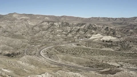 Static aerial of train passing through mountainous region Stock Footage 155457933