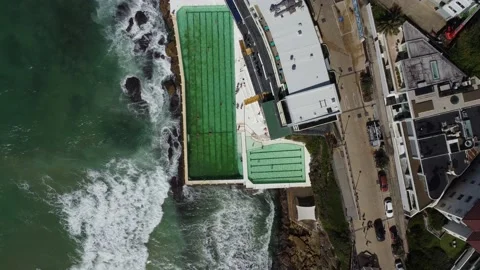 Static Aerial View of The Bondi Icebergs Pool with Waves Crashing Against It Stock Footage 239576792