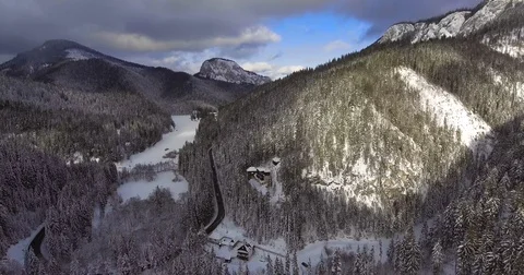 Static Aerial View Of Car Passing Through A Mountain Road In Winter Video stock 84999293
