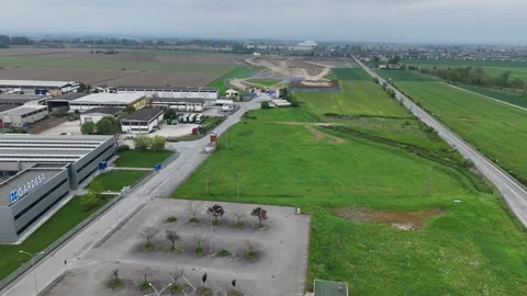 Static aerial view of data center construction beside logistics warehouses in Stock Footage 340604474