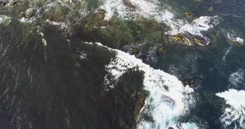 Static aerial view with drone over the shore of a rocky shore Stock-Footage 288574707