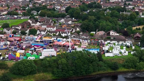 Static Aerial View of Fairground Rides during Local Festival Stock Footage 343423268