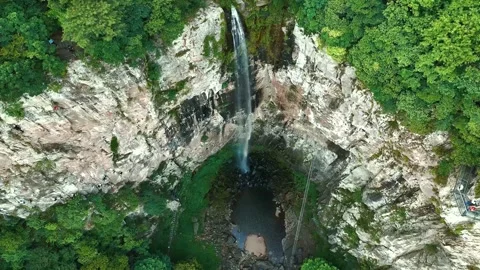 Static Aerial View of Via Ferrata Climbers Beside Xuedou Mountain Waterfall 動画素材 341401883