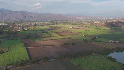 Static aerial view of fields and mountains at sunset in Yautepec Video stock 328263599
