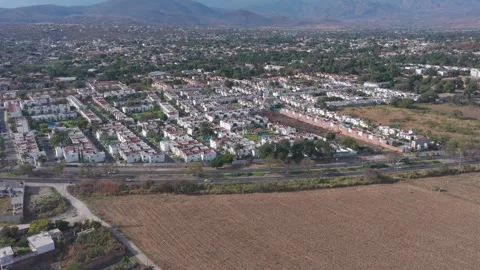 Static aerial view of fields, road, and residential area in Yautepec Video stock 328263548