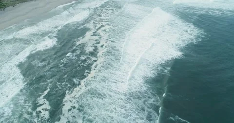 Static aerial view of ocean waves reaching the beach the concept of nature'.. Video stock 326701611