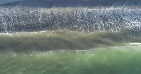 Static aerial view of ocean waves reaching the beach the concept of nature'.. Stock-Footage 327582620