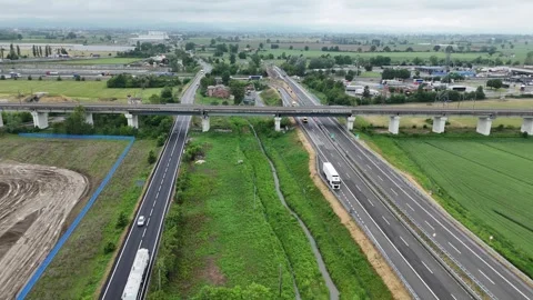 Static aerial view of railway viaduct crossing the A1 motorway near Fiorenzuola Stock Footage 340604196